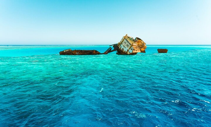 SS Thistlegorm shipwreck amid warm blue waters in Sharm El Sheikh.